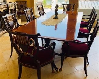 $4,000
BAKER FURNITURE HISTORIC CHARLESTON REPRODUCTIONS DINING TABLE WITH 10 WILLIAM SWITZER FINE UPHOLSTERED CHAIRS 
TABLE WITH 2 LEAVES MEASURES
108”L x 46”W x 29.5”H 
EACH LEAF MEASURES 20”L x 46”W
CHAIR MEASURES
23.5”W x 21.5”D x 38”H
