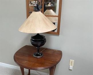 . . . another nice accent table with table lamp, mirror accent