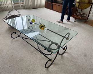 . . . a nice glass coffee table with wrought-iron base