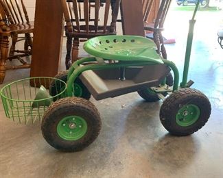 #57	green garden stool on wheels 	 $35.00 
