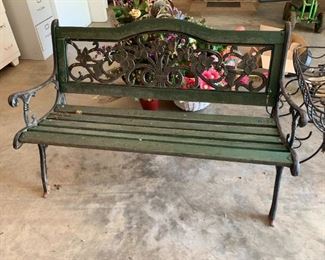 #68	cast iron bench with green painted  wood seat 50 long 	 $75.00 
