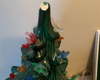 #137	as is ceramic christmas tree with bird lights chip on top 	 $25.00 
