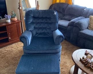 Lovely dark  blue suede loveseat, with matching ottoman. Part of living room furniture set.