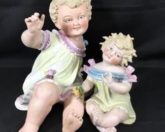 Set of 2 Porcelain Little Girl Piano Baby Statues