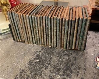 Set of 29 “Little Leather Library”  miniature books & bookends.