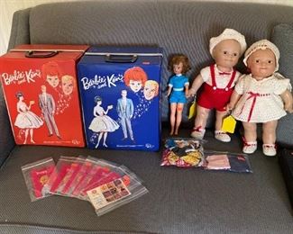 Barbie & Ken carrying cases with dolls & clothes.