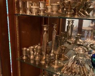 Sterling and silverplate. We have flatware, candlesticks, candy dishes, trays etc. 