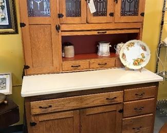 This oak Hoosier Kitchen Cabinet was used every day.  Seller refinished it inside and out.  Excellent condition