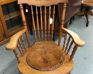 Loves Oak pressed back spindle rocker with leather and nailhead seat.  used to be cane.  Much stronger now.