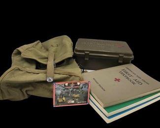 This lot contains military memorabilia like books, first aid kit, USAF bag, and a Desert Storm trading card. https://ctbids.com/#!/description/share/955287
