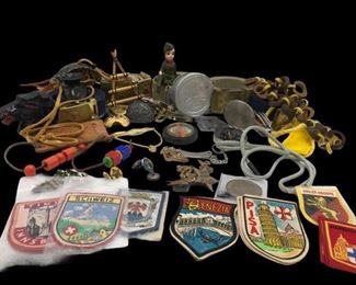 This lot contains a variety of Boy Scout Memorabilia. It contains pins, compass, badges, a statue, belts, and a utility knife. https://ctbids.com/#!/description/share/955289
