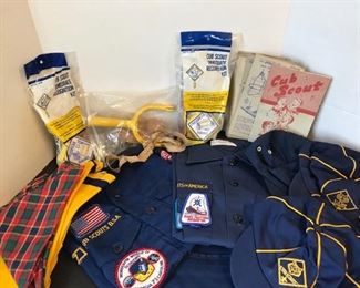 Boy Scout and 2 Cub Scout shirts, one pair of pants(patch work),  three hats, three kerchiefs, a vintage sling shot toy, 2 recognition kits and a collection of cards. https://ctbids.com/#!/description/share/955250