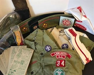 Two vintage Boy Scout shirts along with a pair of pants (Youth Large), three hats, patches, socks, suspenders, and knife carrier(11”). It also contains Boy Scouts instructional cards. https://ctbids.com/#!/description/share/955249