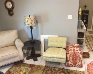 Side table; Occasional chair; Colorful rugs; Patterned throw pillows, and more