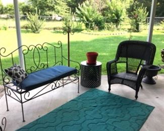 Metal garden bench, wicker chair, and metal garden stool in a distressed silver finish