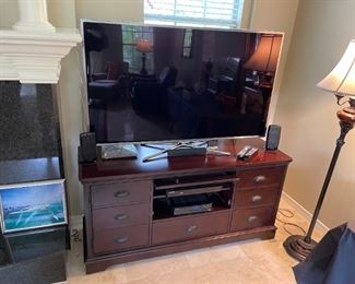 One of two less than 3yr old 55-60" flat screen televisions. 