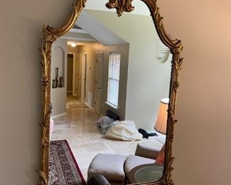Ornate faux brass mirror. 