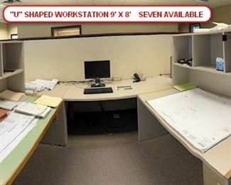 SEVEN U-SHAPED WORK STATIONS. 5 PIECES. PER STATION. CUSTOM MADE. ADJUSTABLE ANGLE ON TOP. (2)-5' X 3' DESKS, 6' SIDE BOARD, 3' SIDE BOARD, 1 BOOKCASE
