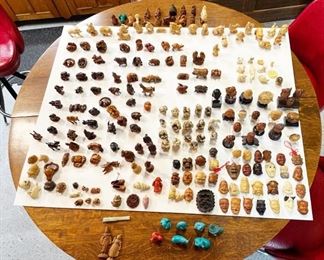 So far I have counted over 200 vintage Netsuke, Okimono etc. and more.  Carvings made from Tagua nut, Boxwood, Resin and much more....  Quite the collection.