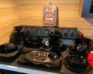 Black depression glass platters, plates, bowls, cups and vases