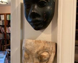 Two antique mask molds