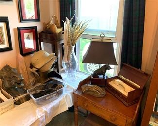 Vintage horse head bust, turtle shells, porcupine quills, faux feathers, pink marble geometric pillar, genuine armadillo taxidermy basket, hard top safari hats