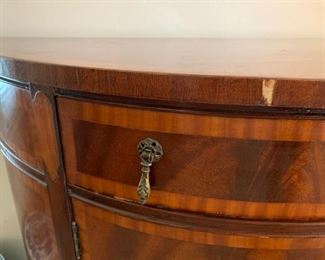 Beautiful antique/vintage demilune half moon cabinet with custom glass top. In great condition with one knick on trim and some wear/scratches on feet. Measures 38" wide, 19.5" deep and 33" tall. 