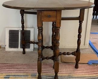 Antique turned gateleg table in excellent condition, such a cool piece! Measures 38" wide with both leaves open and only 11" wide with both leaves down. 29" deep and 30" tall