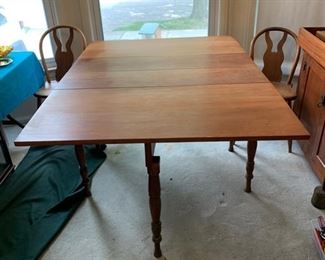 Antique Shaker dining table, partially restored. Measures 64" wide with leaves open, 22" wide with leaves down. 45" wide, in excellent condition