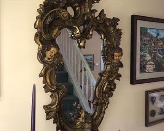 Antique gold leaf mirror with cherubs, back has been replaced on mirror,  he rubs are in good condition, still has a lot of gilding remaining on frame.