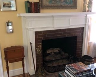 beautiful fireplace with tools, apron, skirt, Hibel painting, reproduction pipe stand, area rug, modern coffee table, antique books, coffee table books
