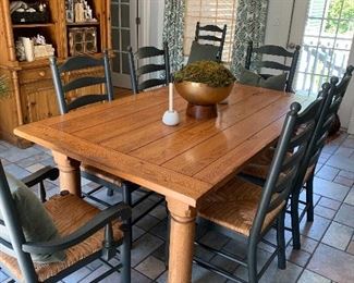 Farmhouse table with two leaves and two arm chairs and six side chairs.   (Table: 72” L x 44” W x 30” H
Leaves measure 18” each (108” overall) )
