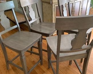 Four solid wood 25" counter stools