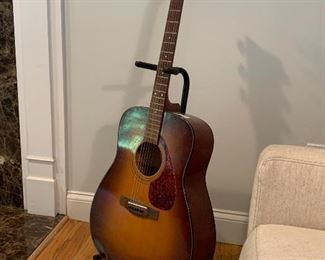 Acoustic guitar and stand
