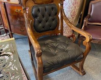 Highly carved antique wood rocking chair