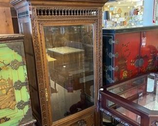 Antique curio cabinet with beautiful hand carving