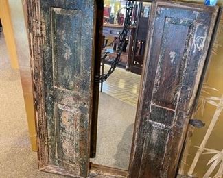 Dramatic shabby chic mirror with folding doors. This is a great piece that has kind of a medieval look