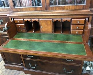 Mahogany Breakfront with beautiful hidden butlers desk with leather writing surface. Delivery can be arranged for a fee.