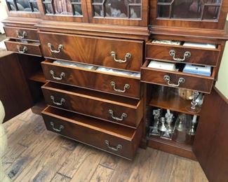 Mahogany Breakfront Cabinet with four large center drawers in the middle and two small drawers on both sides with swinging doors. Delivery can be arranged for fee.