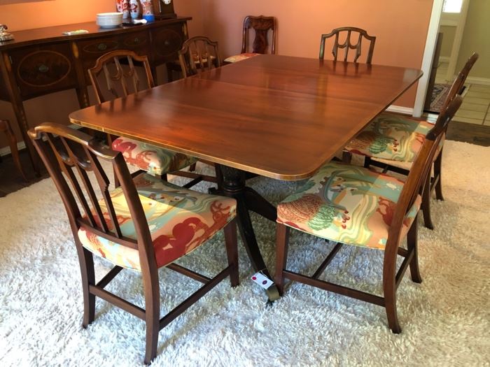 Mahogany Dining Room Table & 6 chairs. Chairs are in perfect condition and can be sold separate for $120 each or with the table. There are five sections that can be added to the table to accommodate a large group of people. 46 (98) x 68 x 28. $1,300 for entire table set.