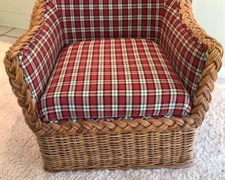 Wicker chair with lovely red striped pattern cushion. In excellent shape with stylish interwoven braided wrap around wicker. $200