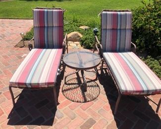 2 outdoor chaise and glass table. Fabric faded but no rips. Good condition. $170
