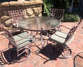 42” glass round table with 4 metal back swivel chairs. Paint on chairs weathered. Good condition. $325