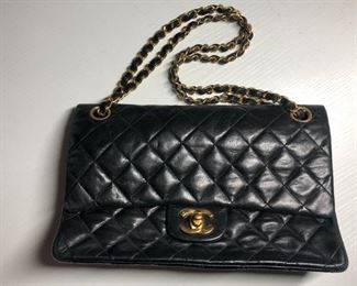 SOLD.  Vintage Chanel "quilted" lambskin bag. Maroon/red interior; single interior pocket; chain link shoulder strap (16" drop); snap close front. Very good condition. Shipping available. $2,200