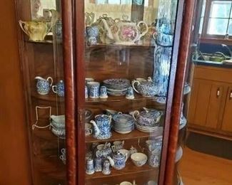 Antique china cabinet full of blue white china