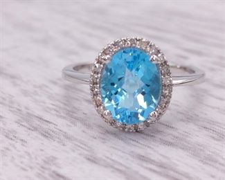 Light Blue 2.4 Carat Topaz and Diamond Halo Ring in 14kt Gold
