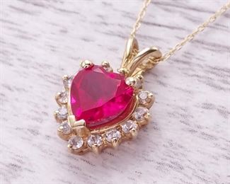 Heart Shaped Ruby Necklace With Diamond Halo in Yellow Gold
