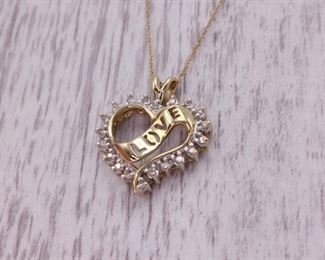 Heart Shaped Diamond Pendant With "Love" Ribbon in Yellow Gold
