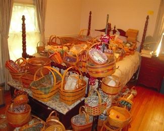 just a few of 100`s Longaberger baskets. cherry Cumberland valley bed