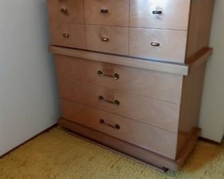 Beige wood bedroom dresser.  Contents not included.  Part of a set including another dresser with mirror and two nightstands.